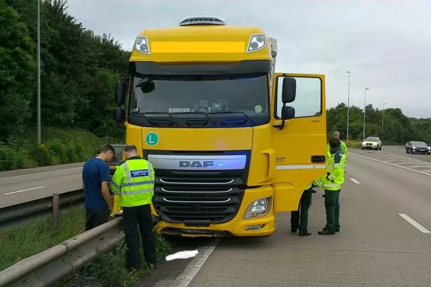 Delays expected as lorry collides into central reservation on M53